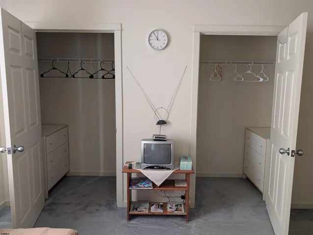 a bedroom with a bed and furniture