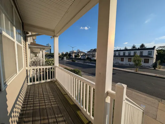 a view of balcony with wooden floor