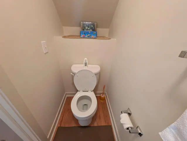 a bathroom with a sink toilet and mirror