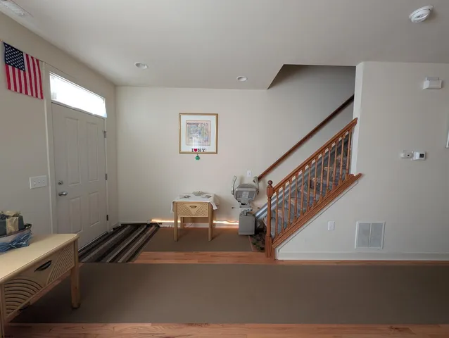a kitchen with stainless steel appliances wooden cabinets granite counter tops and a stove top oven