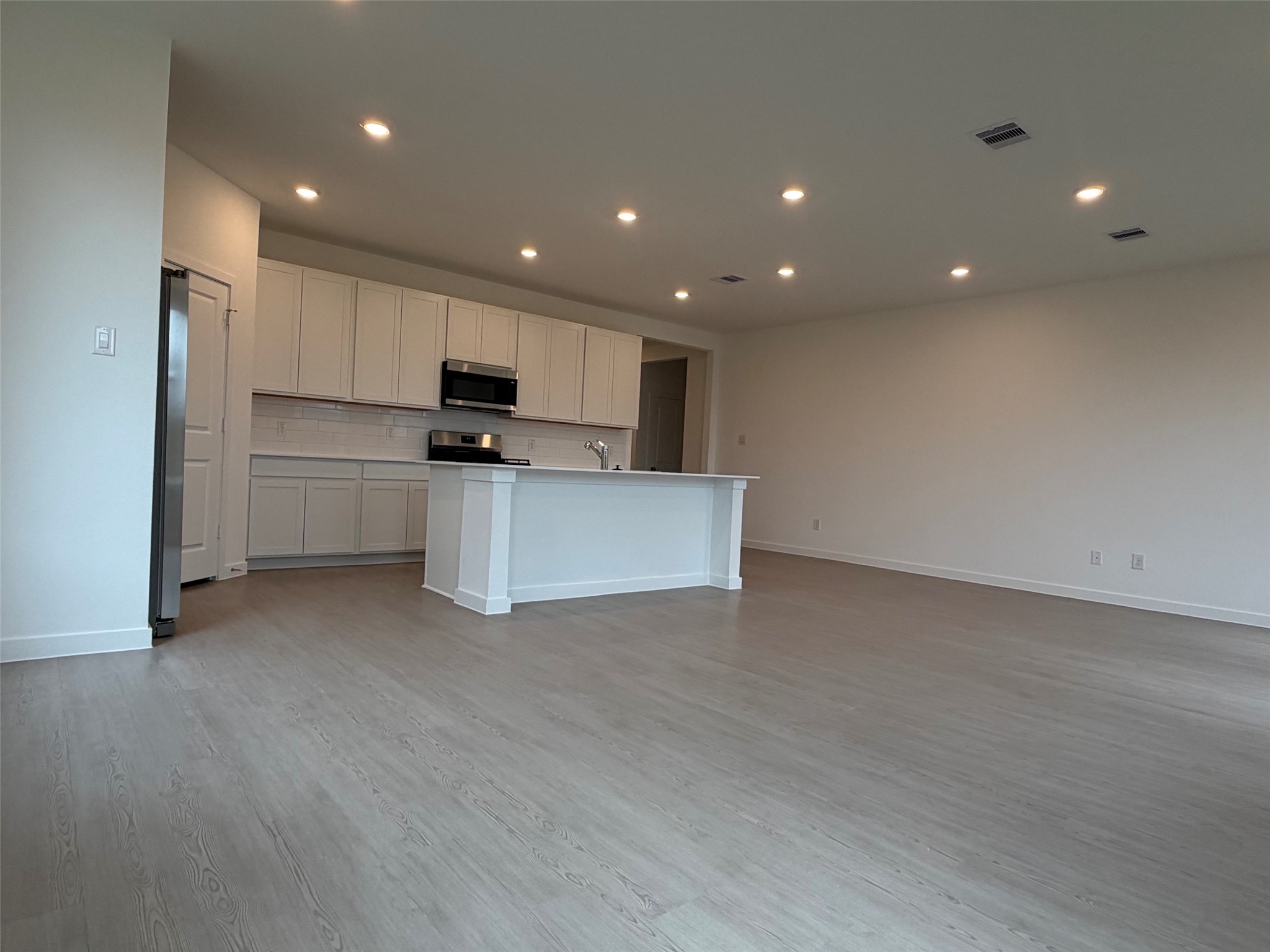 2514 Rose Gold Drive Rosharon, TX 77583 - Photo 6 of 27 a view of kitchen with kitchen island stainless steel appliances a sink and a refrigerator
