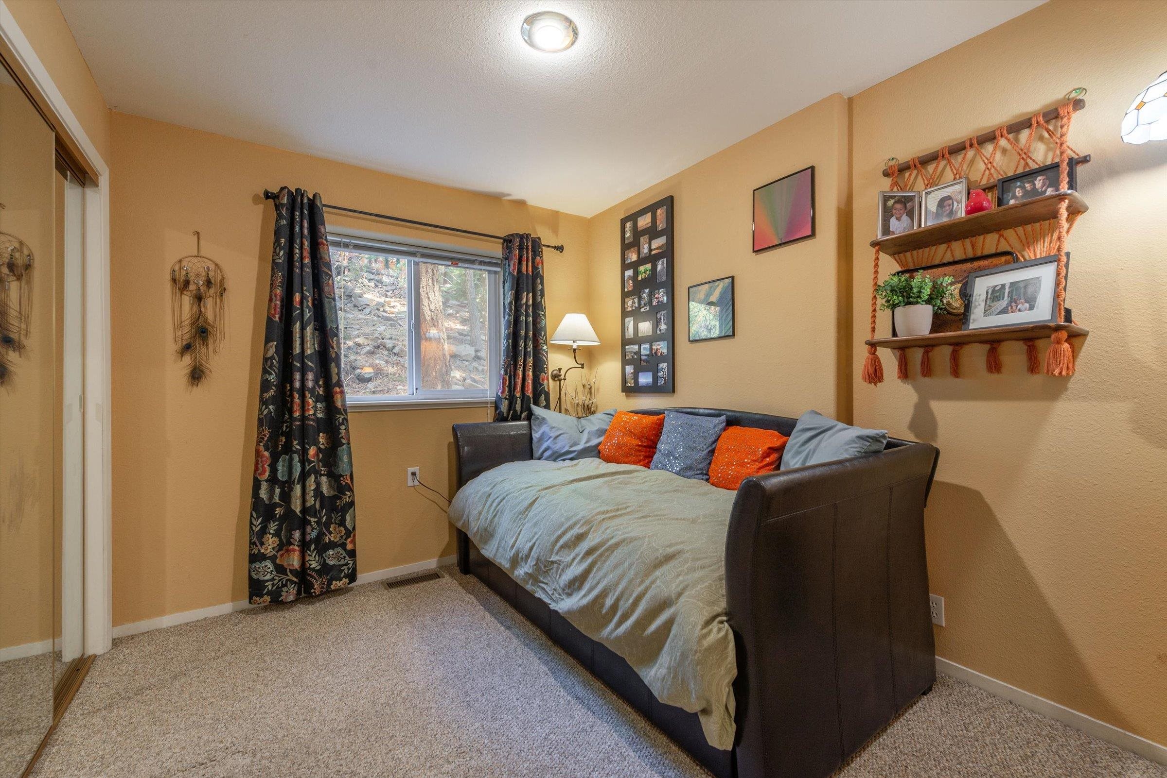 12860 Dulzura Street Truckee, CA 96161 - Photo 11 of 21 a bedroom with a bed and a window