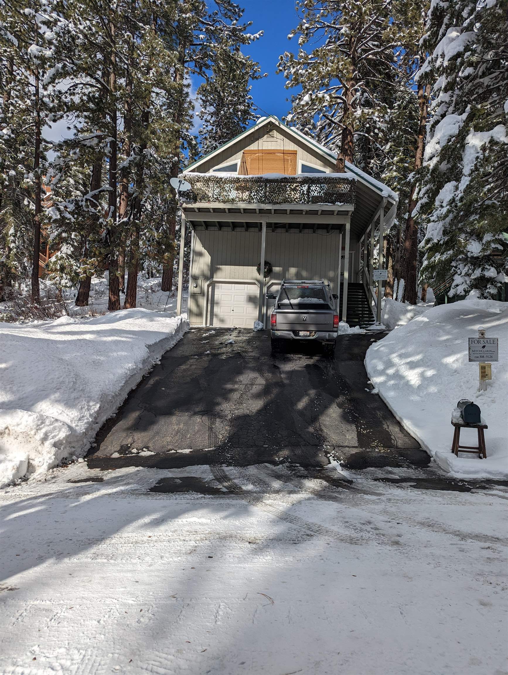 12860 Dulzura Street Truckee, CA 96161 - Photo 14 of 21 a front view of a house with a yard and garage