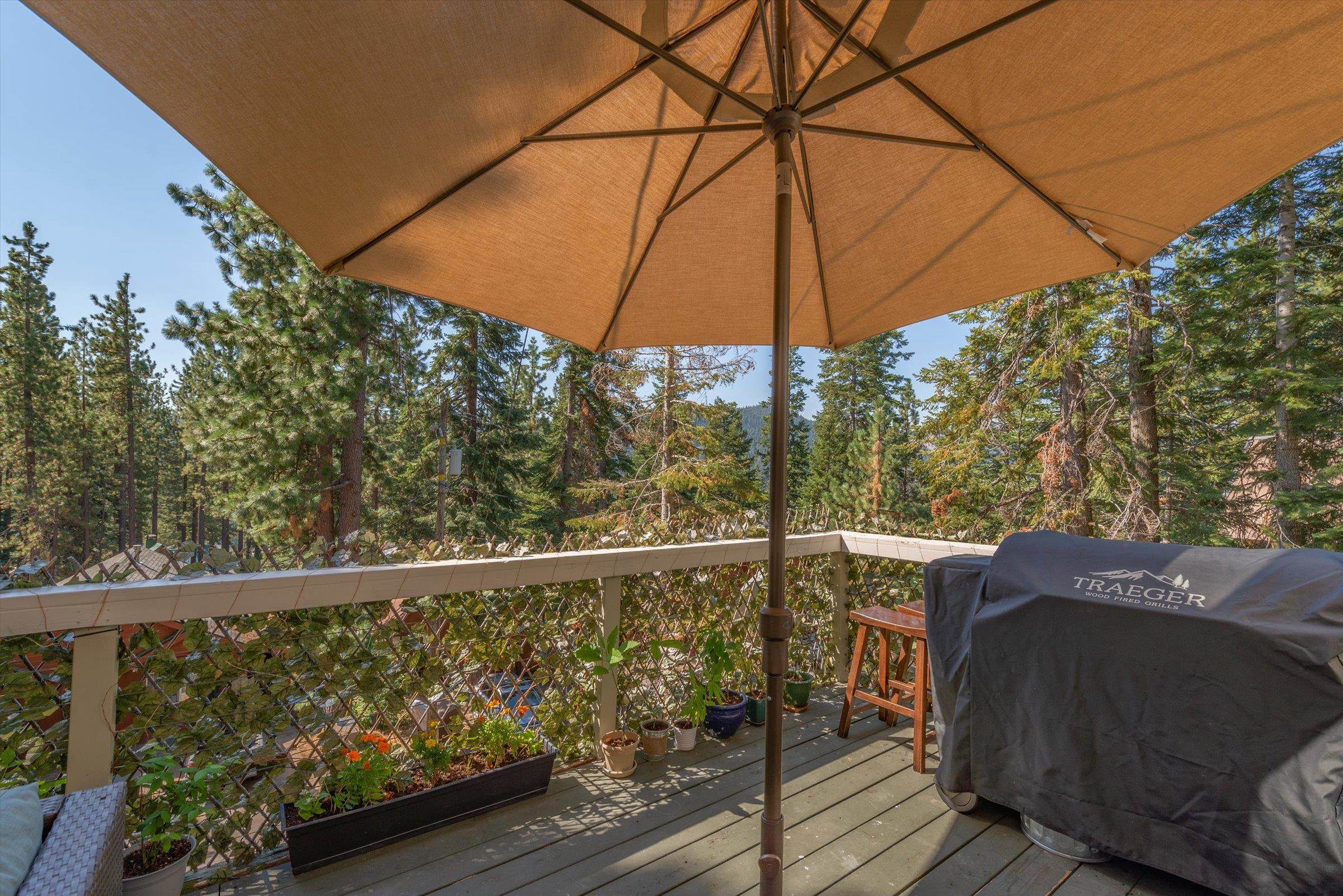12860 Dulzura Street Truckee, CA 96161 - Photo 21 of 21 a view of balcony with furniture and umbrella