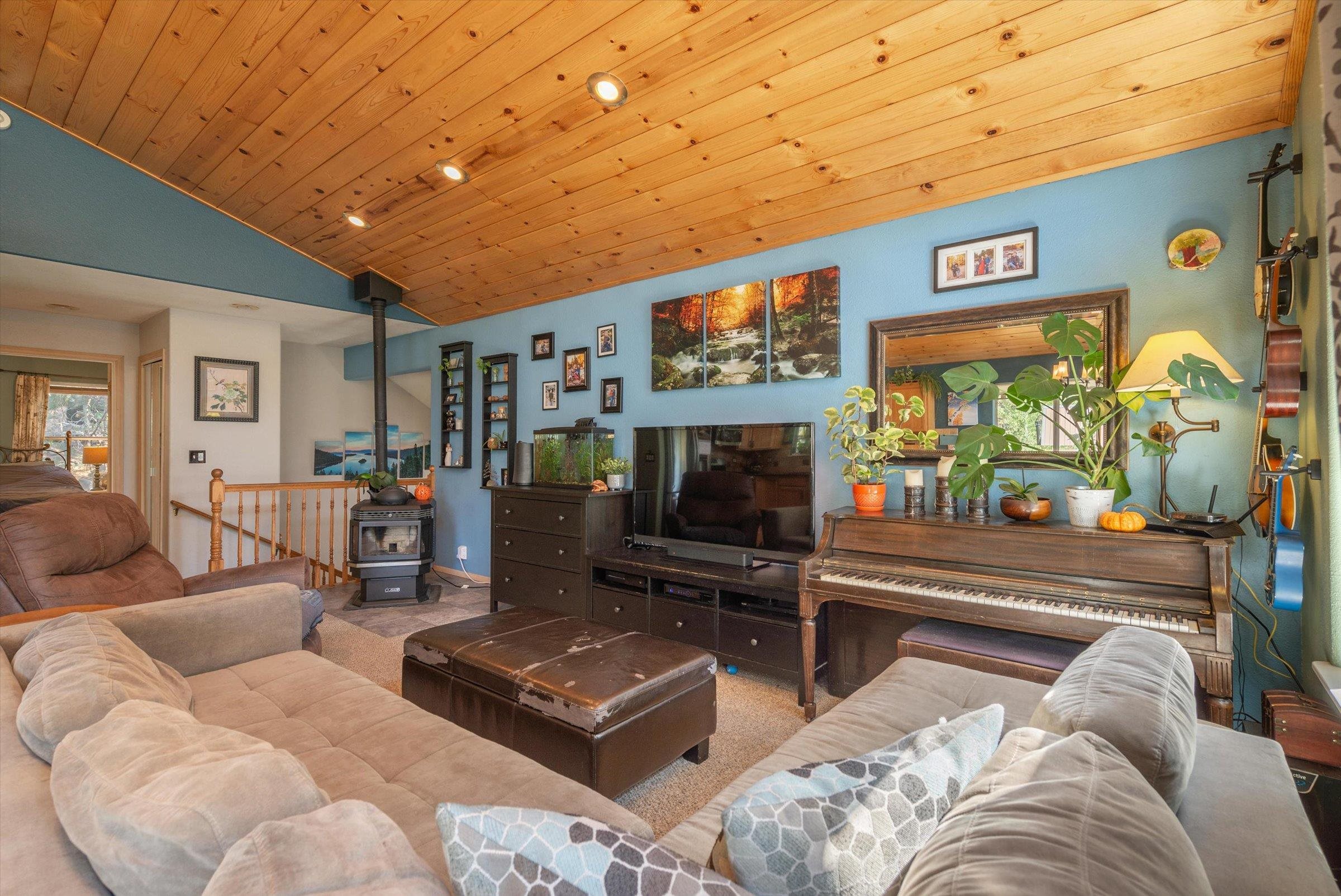 12860 Dulzura Street Truckee, CA 96161 - Photo 3 of 21 a living room with furniture and a flat screen tv