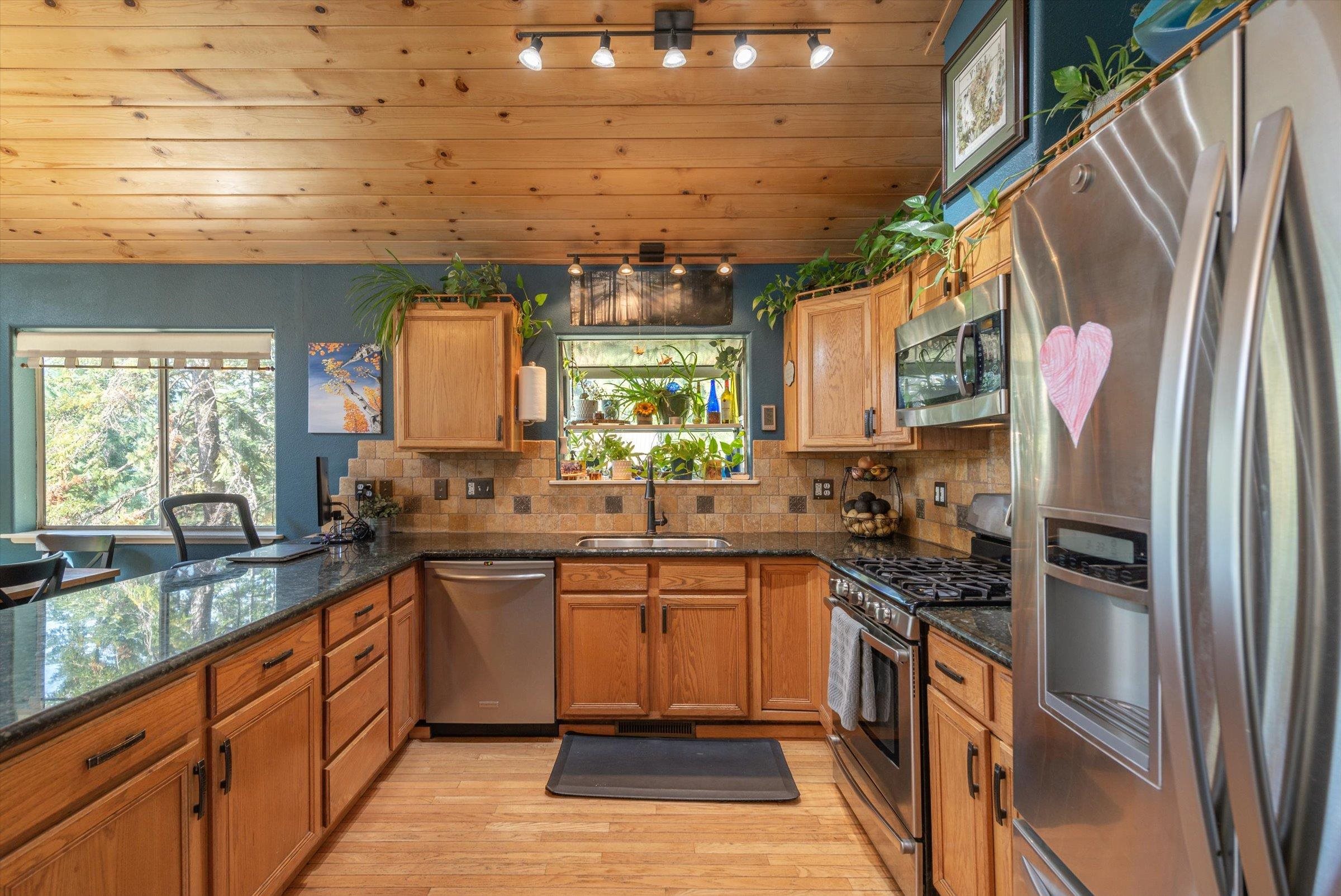 12860 Dulzura Street Truckee, CA 96161 - Photo 6 of 21 a kitchen with stainless steel appliances a sink stove and refrigerator