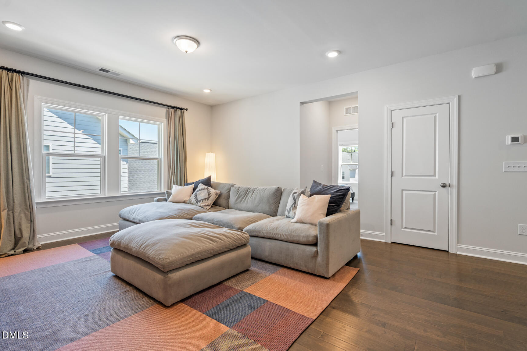 2966 Rise And Shine Road Apex, NC 27502 - Photo 25 of 61 a living room with furniture and a large window