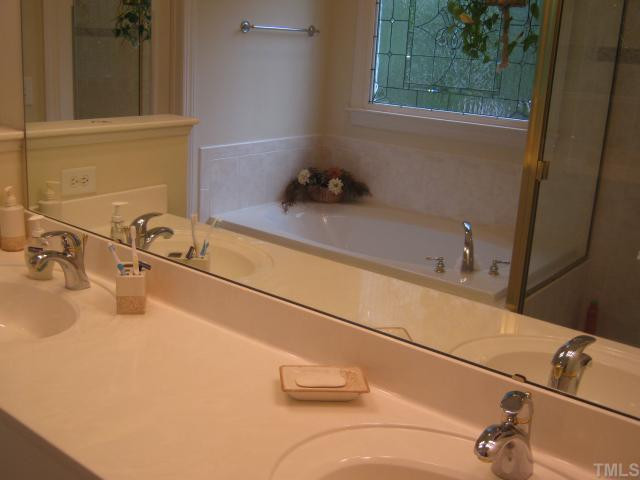 5201 Indigo Moon Way Raleigh, NC 27613 - Photo 10 of 12 All you need in the morning! Seperate garden tub and large shower! Raised two vanities and large walk in closet! Tile floors and more! Master Bath/Spa