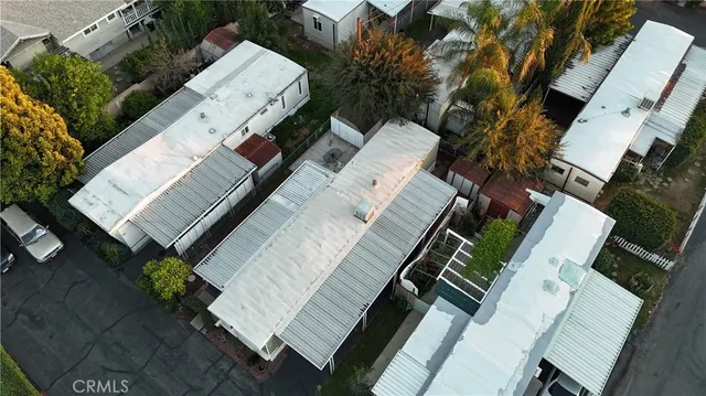 an aerial view of a house with outdoor space