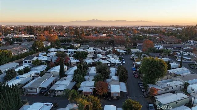 an aerial view of residential houses with city view