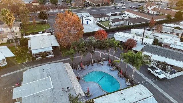 an aerial view of a house with a yard basket ball court
