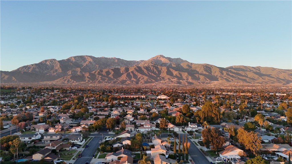 9340 Foothill Rancho Cucamonga, CA 91730 - Photo 19 of 21 an aerial view of residential house and mountains in the background