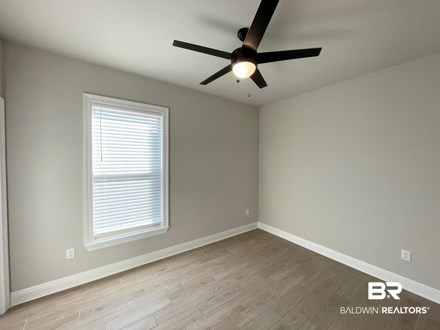 1355 Fenton Circle Foley, AL 36535 - Photo 10 of 17 Unfurnished room featuring light hardwood / wood-style floors and ceiling fan