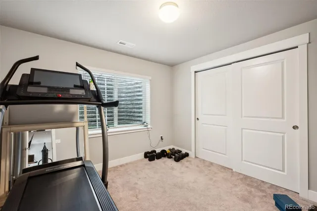 a room with a bed and a window