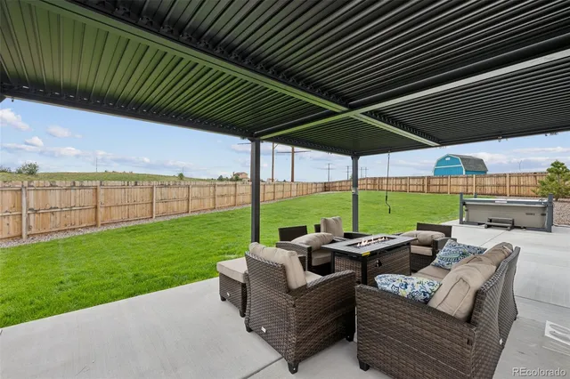 a patio with yard table and chairs
