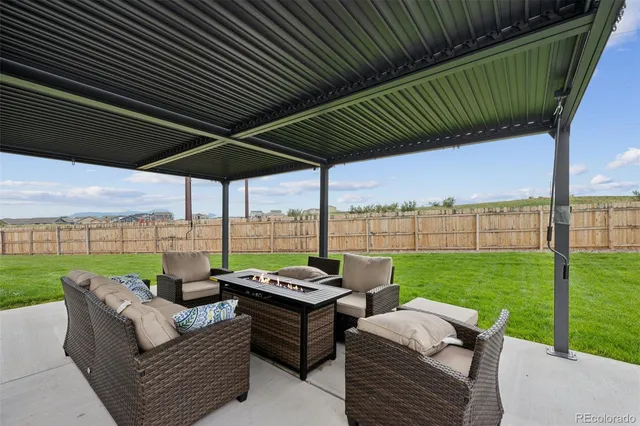 a view of a patio with couches chairs dining table and chairs