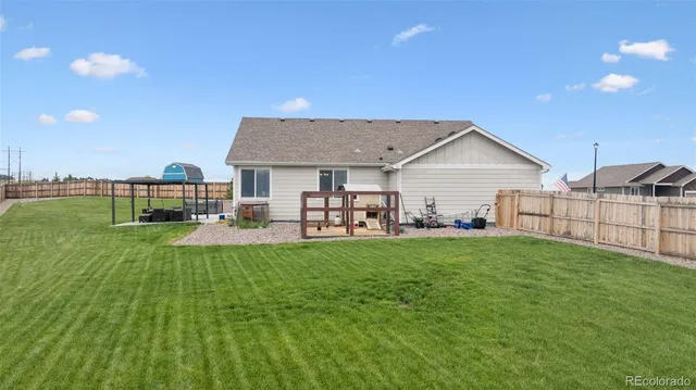 a view of a house with backyard porch and garden
