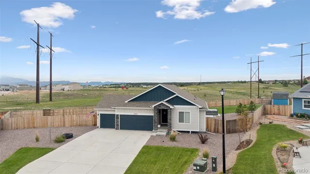 a view of a terrace with a table and chairs