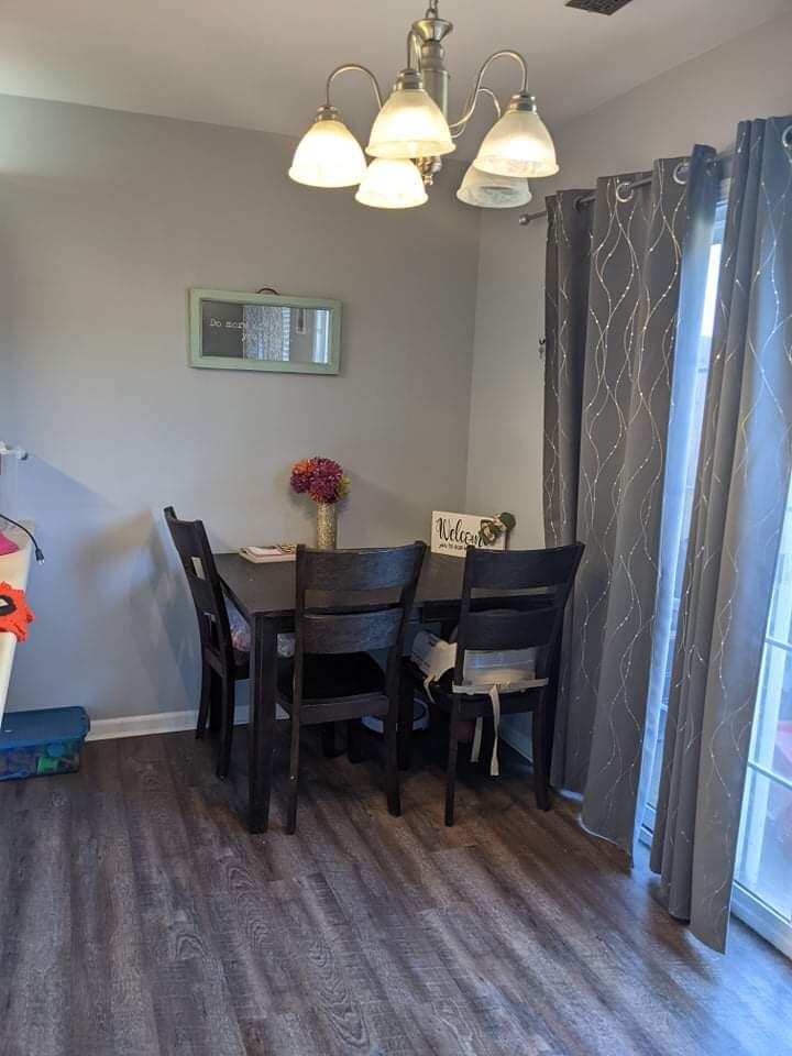 369 South Boo Road, Unit B Burns Harbor, IN 46304 - Photo 12 of 23 a view of a dining room with furniture and wooden floor