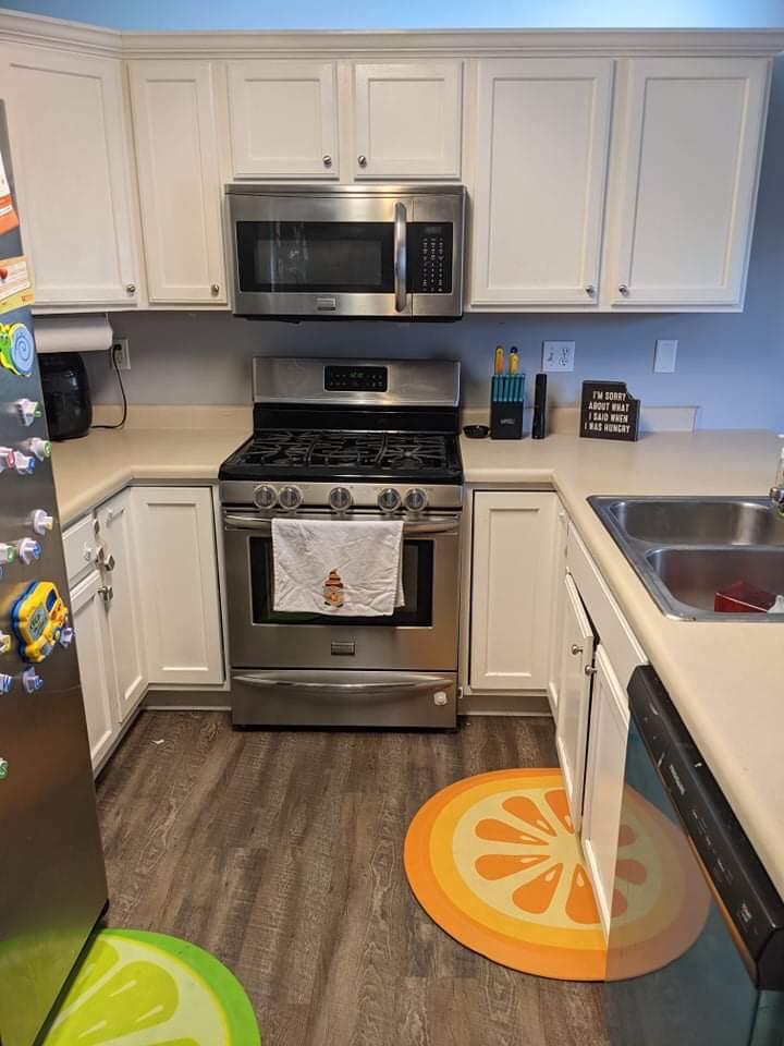 369 South Boo Road, Unit B Burns Harbor, IN 46304 - Photo 13 of 23 a kitchen with stainless steel appliances granite countertop a stove a sink and a microwave