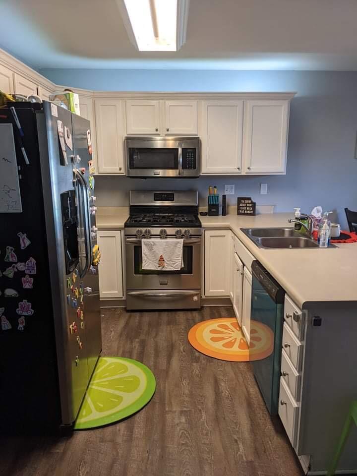 369 South Boo Road, Unit B Burns Harbor, IN 46304 - Photo 14 of 23 a kitchen with stainless steel appliances a stove a sink cabinets and a refrigerator