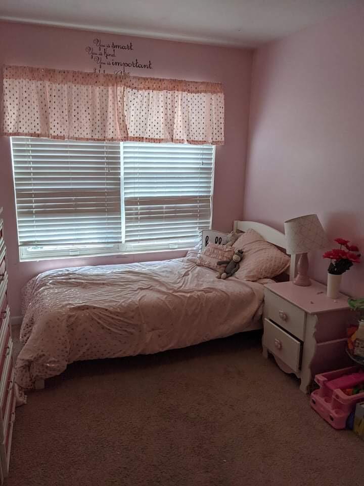 369 South Boo Road, Unit B Burns Harbor, IN 46304 - Photo 15 of 23 a bedroom with a bed and window