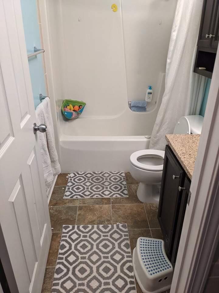 369 South Boo Road, Unit B Burns Harbor, IN 46304 - Photo 20 of 23 a bathroom with a sink a toilet and a bathtub