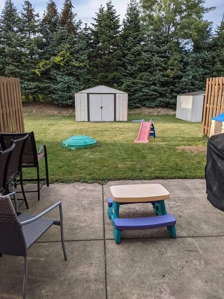 369 South Boo Road, Unit B Burns Harbor, IN 46304 - Photo 23 of 23 a backyard of a house with table and chairs
