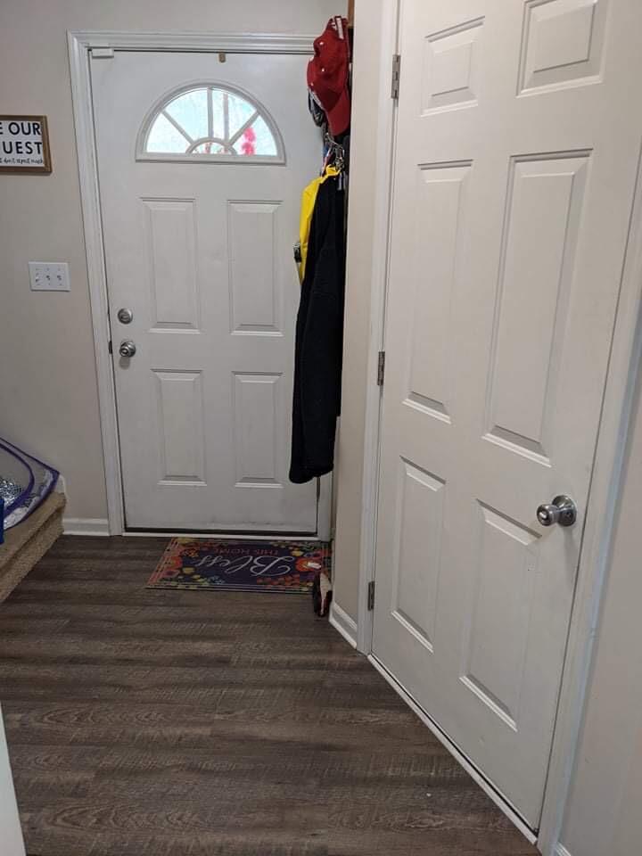 369 South Boo Road, Unit B Burns Harbor, IN 46304 - Photo 6 of 23 a view of a hallway with wooden floor and staircase