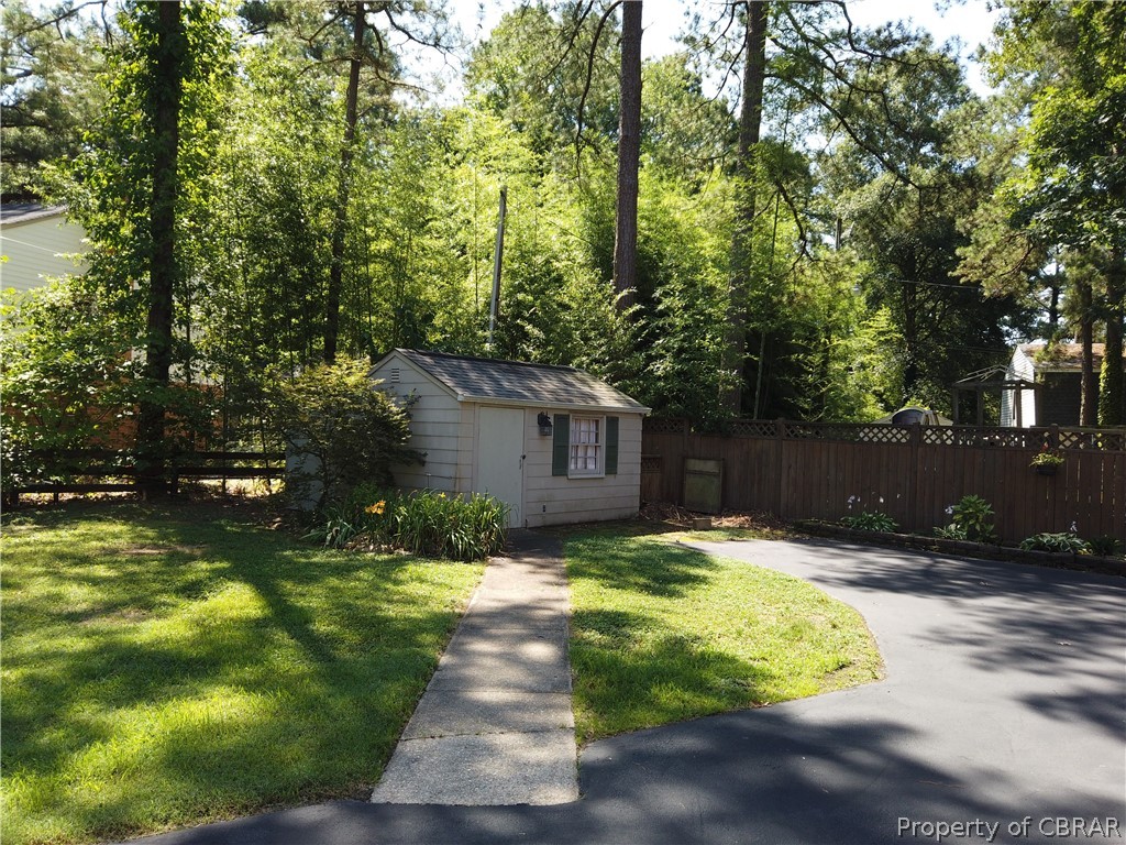 230 Treva Road Sandston, VA 23150 - Photo 8 of 40 Sidewalk to shed with lean to on back side