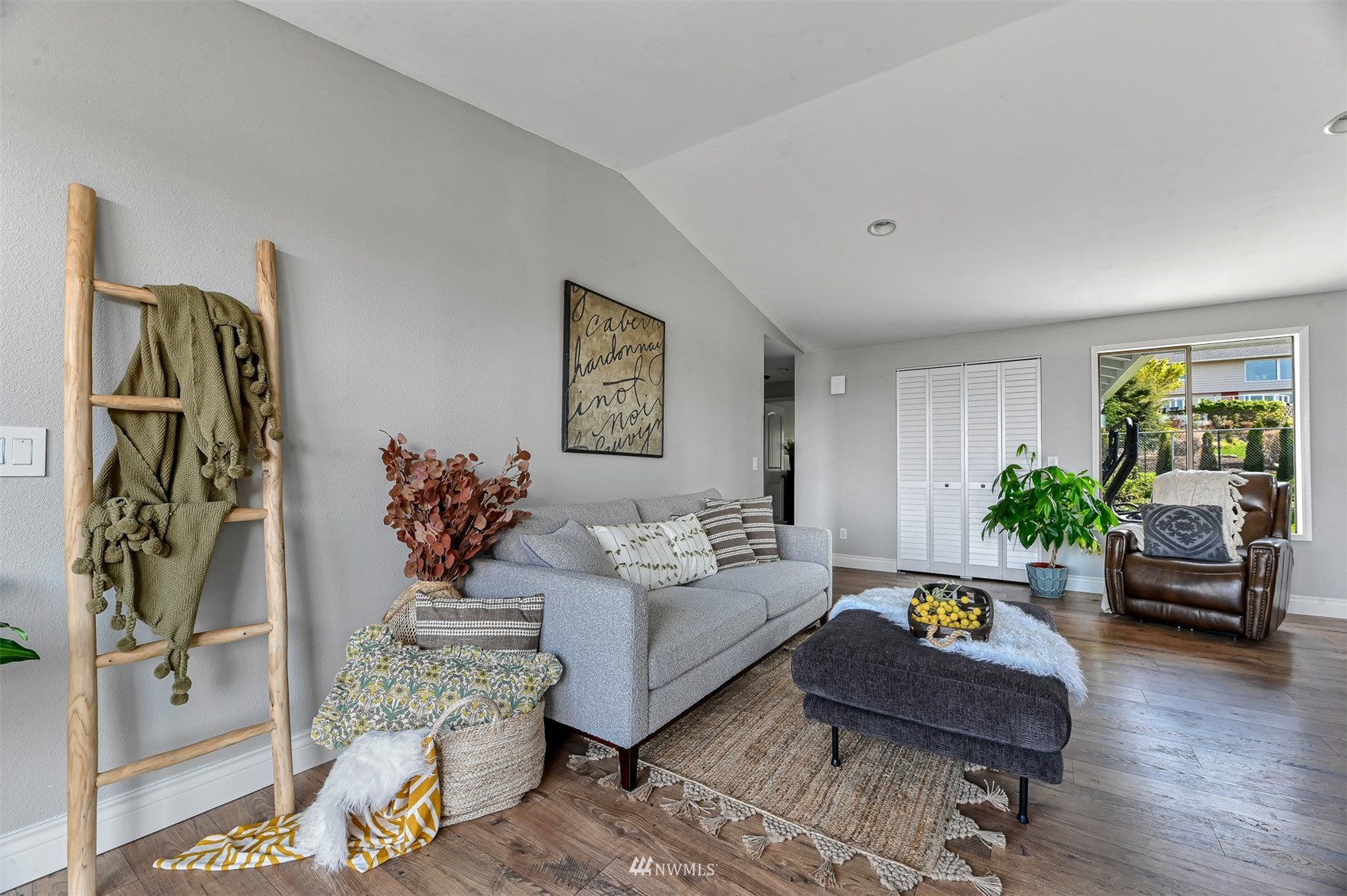 232 Bayside Road Bellingham, WA 98225 - Photo 8 of 40 a living room with furniture and wooden floor