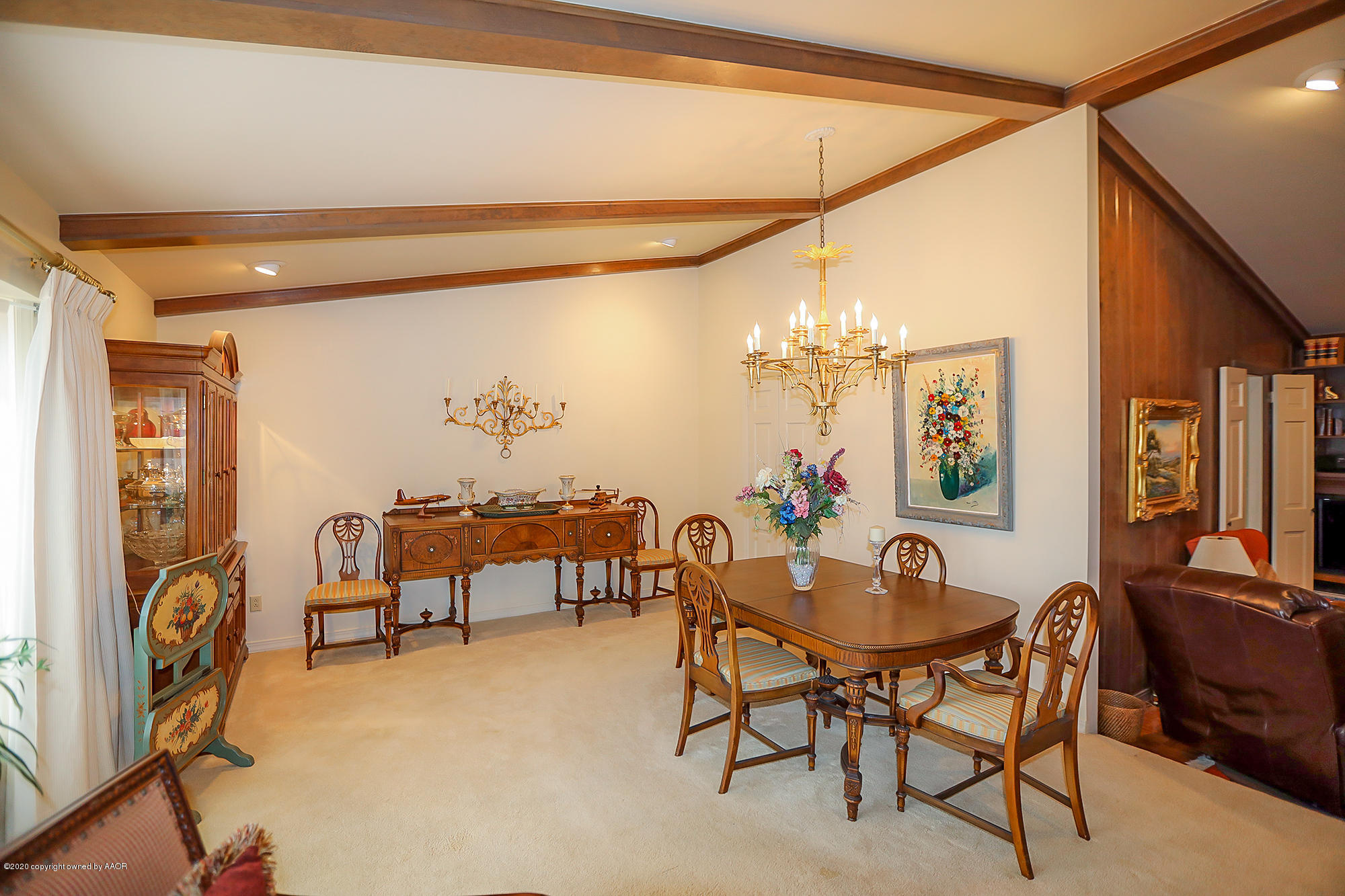 6908 Calumet Road Amarillo, TX 79106 - Photo 13 of 40 a view of a dining room with furniture and chandelier