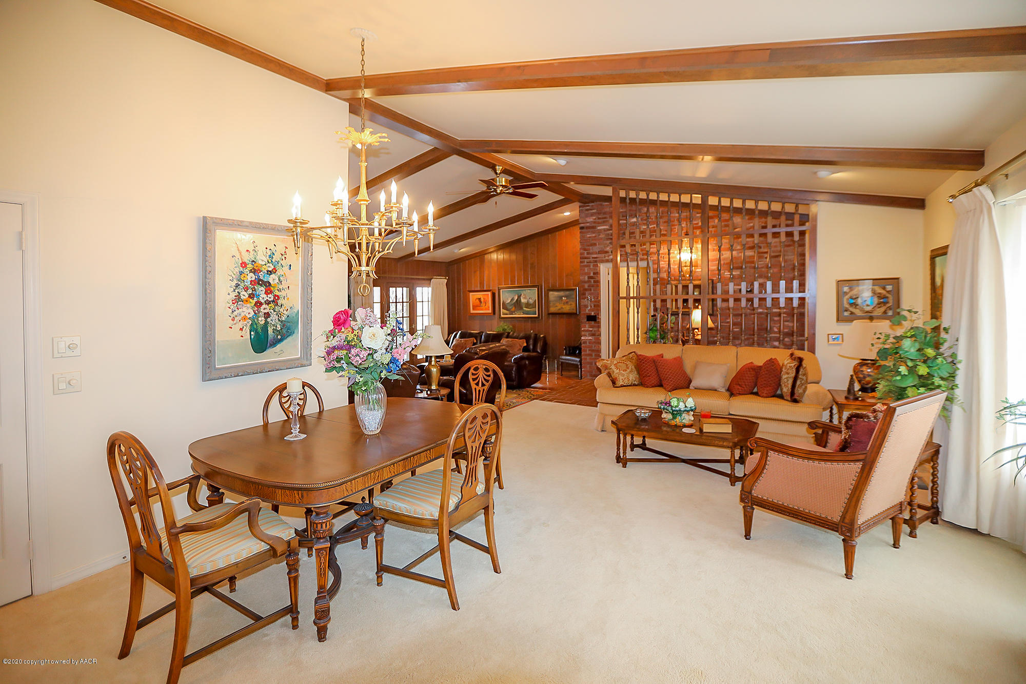 6908 Calumet Road Amarillo, TX 79106 - Photo 15 of 40 a dining room with furniture and a chandelier