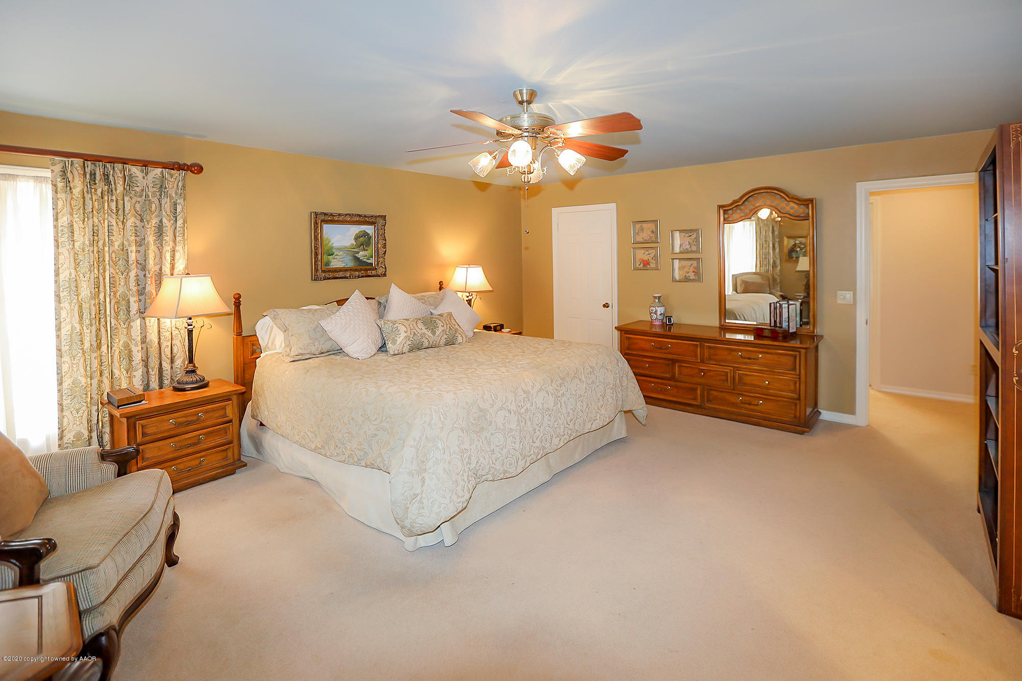 6908 Calumet Road Amarillo, TX 79106 - Photo 17 of 40 a bedroom with a bed and window