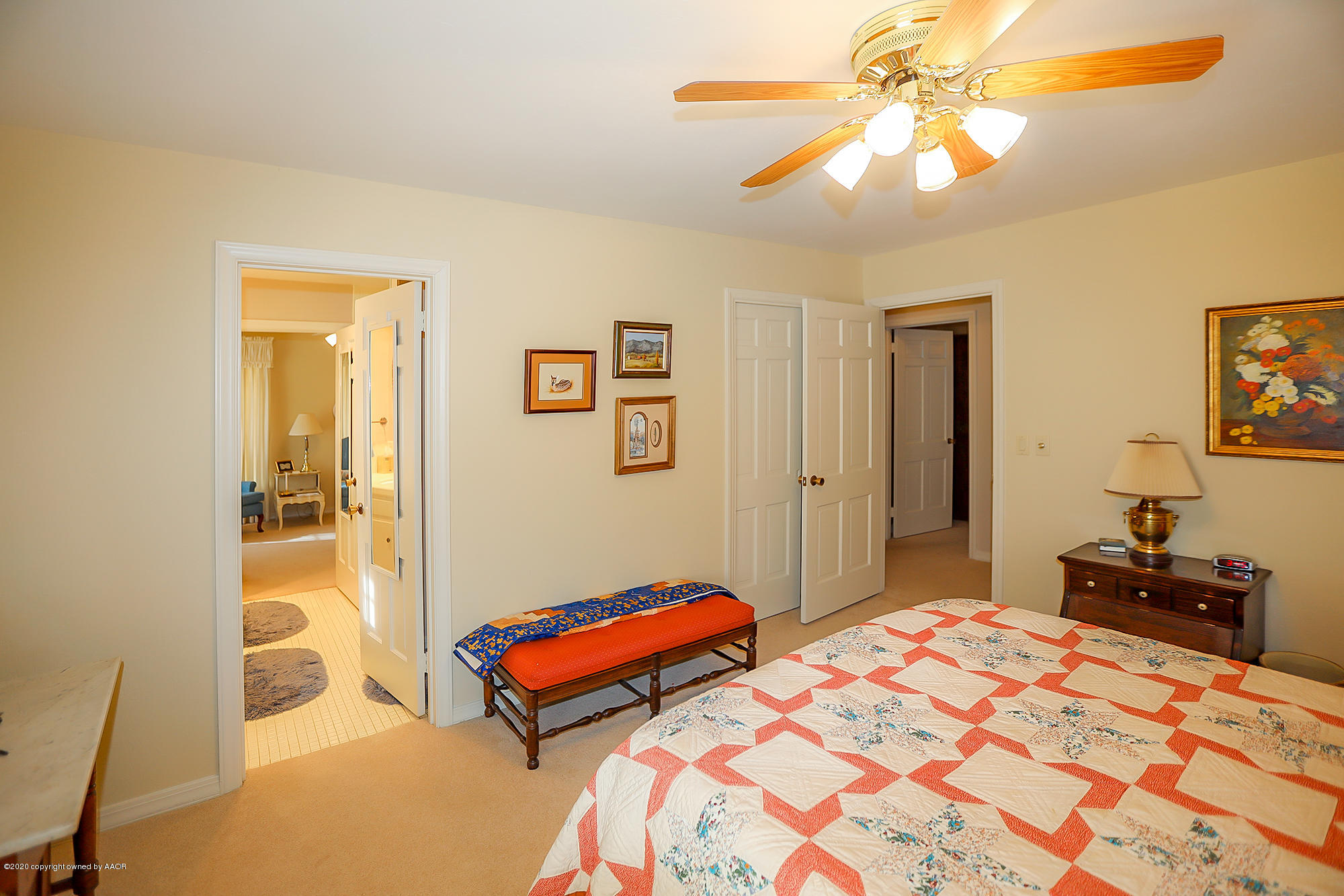 6908 Calumet Road Amarillo, TX 79106 - Photo 25 of 40 a bedroom with a bed and a chandelier