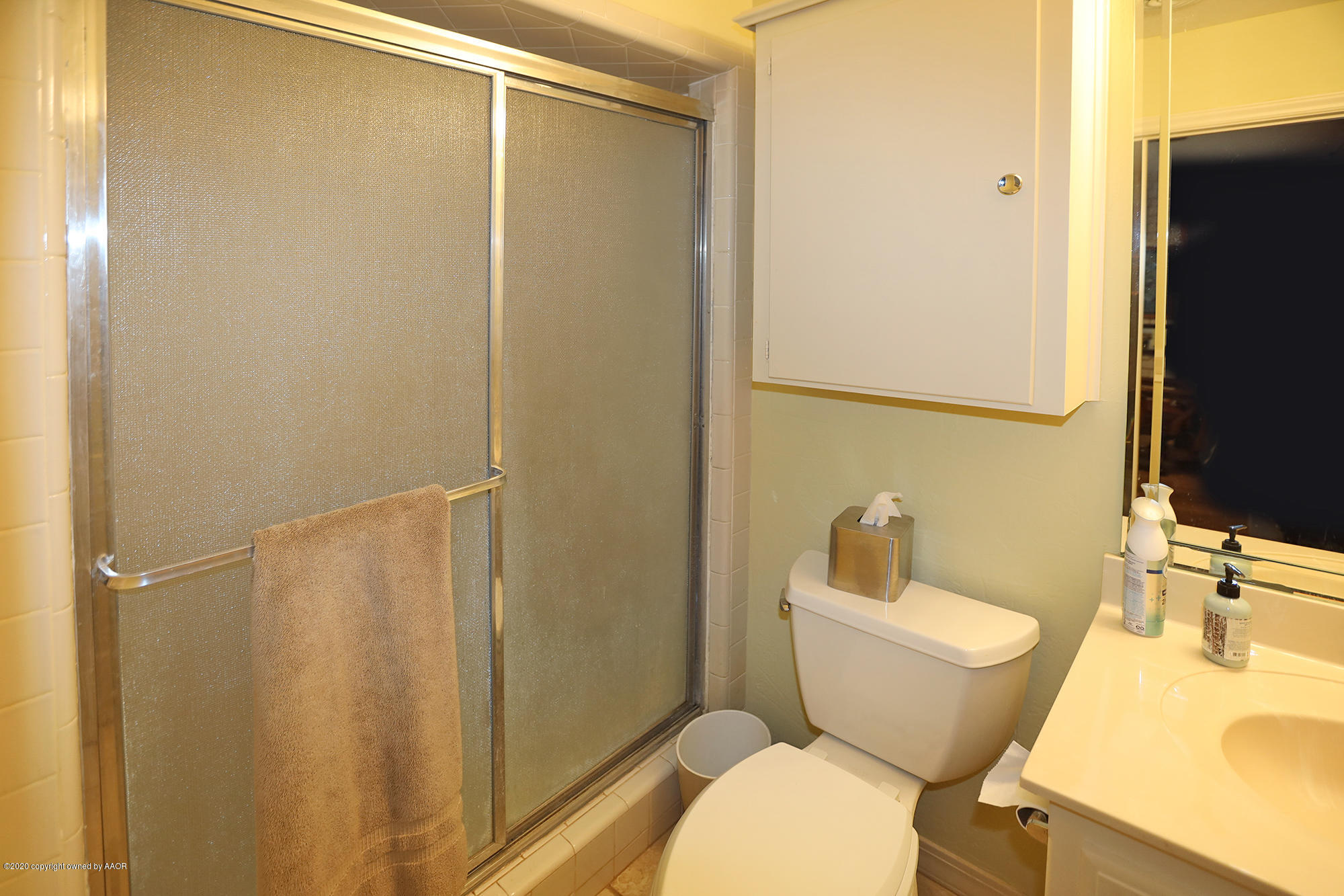 6908 Calumet Road Amarillo, TX 79106 - Photo 31 of 40 a bathroom with a sink toilet and shower