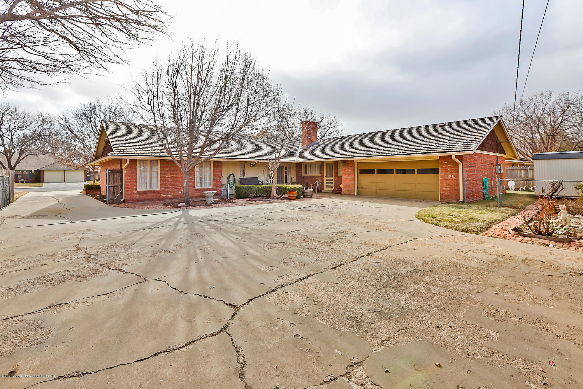 6908 Calumet Road Amarillo, TX 79106 - Photo 37 of 40 a view of a yard with cars