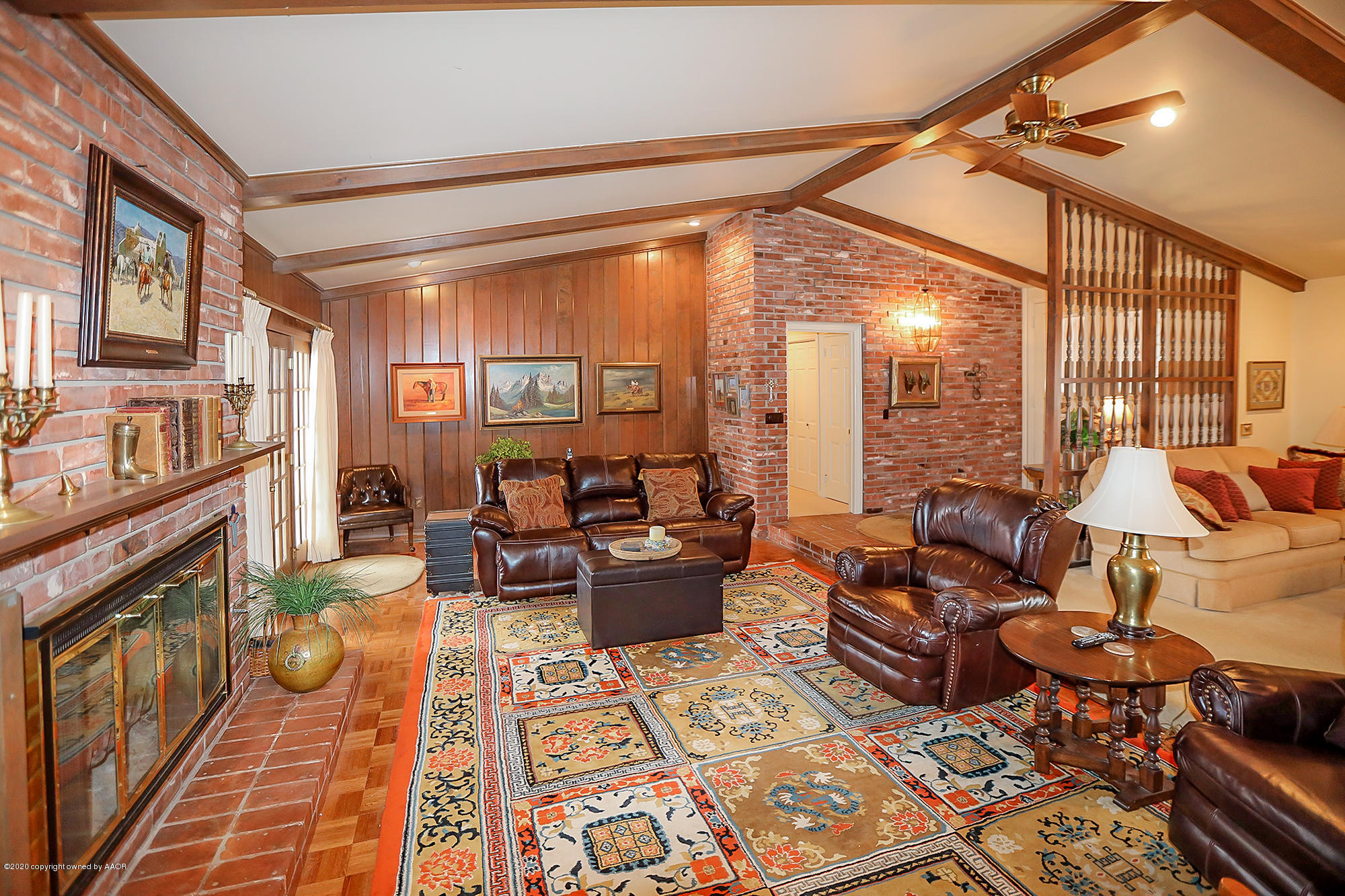 6908 Calumet Road Amarillo, TX 79106 - Photo 5 of 40 a living room with furniture and a fireplace