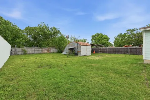 a backyard of a house with lots of green space