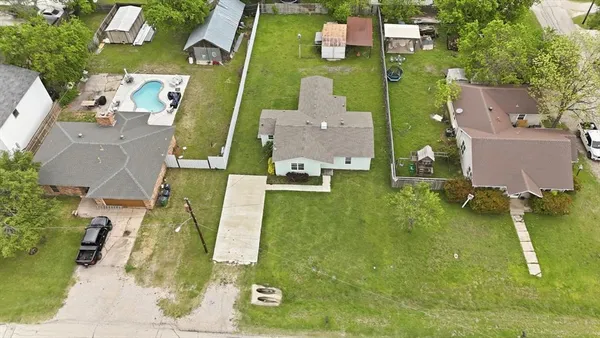 an aerial view of a house with a swimming pool