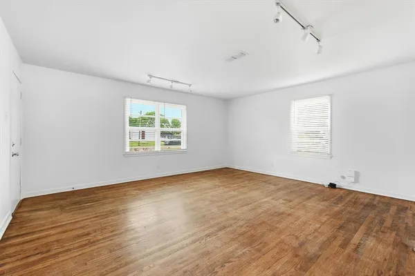 an empty room with windows