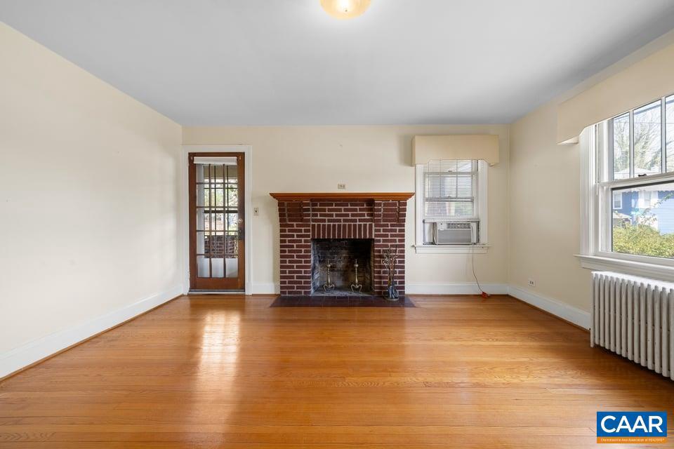 1201 Avon Street Charlottesville, VA 22902 - Photo 14 of 71 an empty room with windows and fireplace