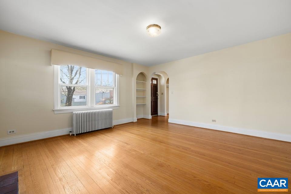 1201 Avon Street Charlottesville, VA 22902 - Photo 17 of 71 an empty room with wooden floor and windows