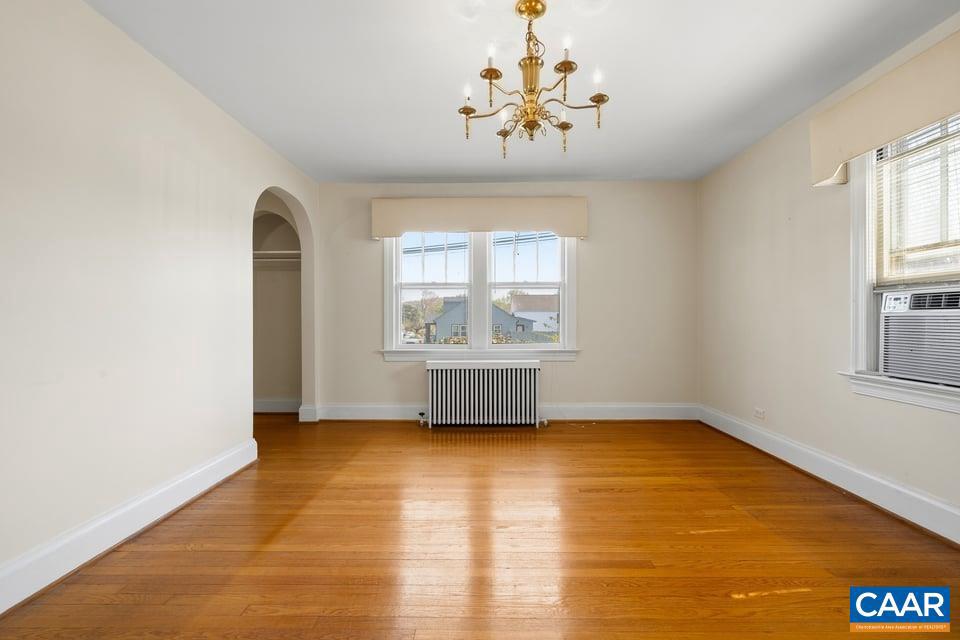 1201 Avon Street Charlottesville, VA 22902 - Photo 20 of 71 a view of an empty room with a window and wooden floor