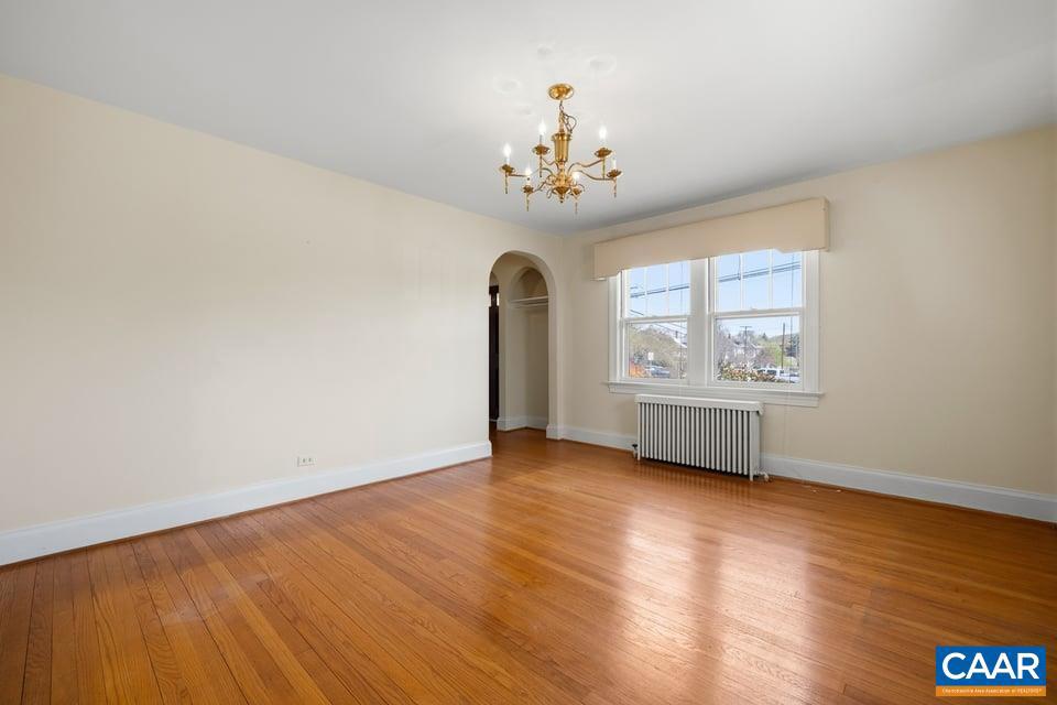 1201 Avon Street Charlottesville, VA 22902 - Photo 22 of 71 a view of an empty room with a window and wooden floor