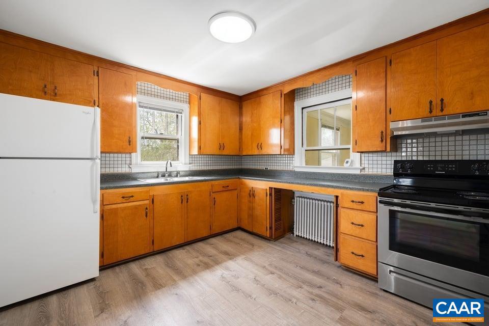 1201 Avon Street Charlottesville, VA 22902 - Photo 25 of 71 a kitchen with stainless steel appliances granite countertop a stove a sink and a refrigerator