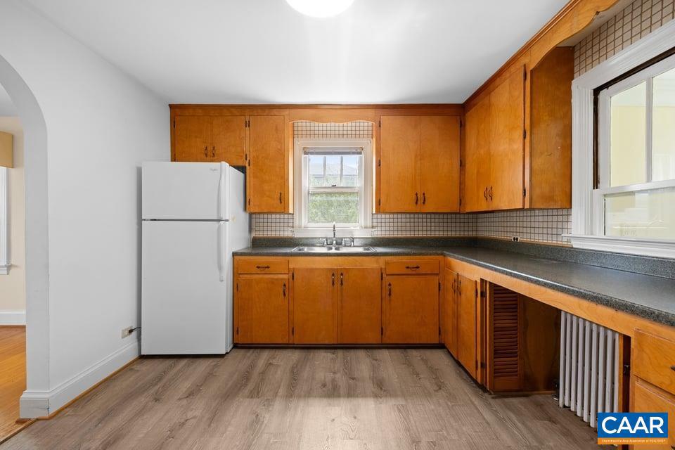 1201 Avon Street Charlottesville, VA 22902 - Photo 28 of 71 a kitchen with stainless steel appliances granite countertop a refrigerator sink and cabinets