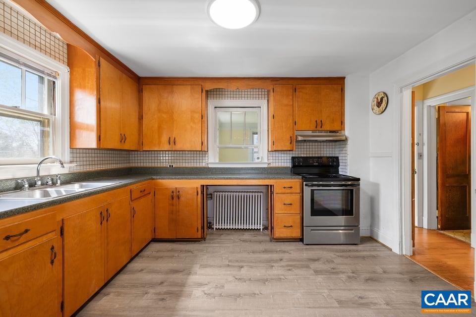 1201 Avon Street Charlottesville, VA 22902 - Photo 29 of 71 a kitchen with granite countertop a stove top oven a sink and dishwasher