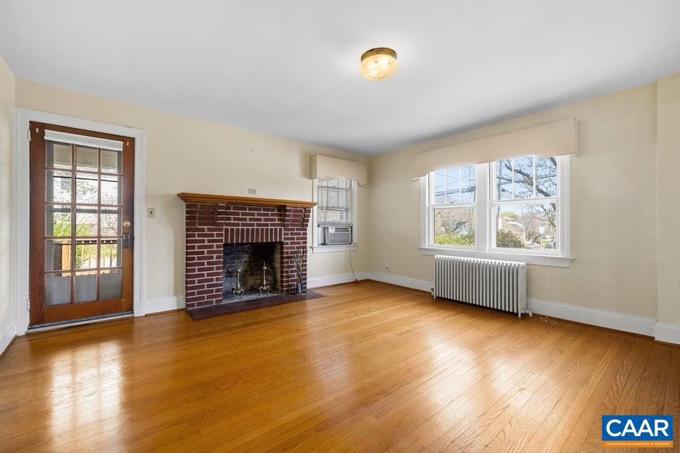 1201 Avon Street Charlottesville, VA 22902 - Photo 4 of 71 an empty room with windows and fireplace