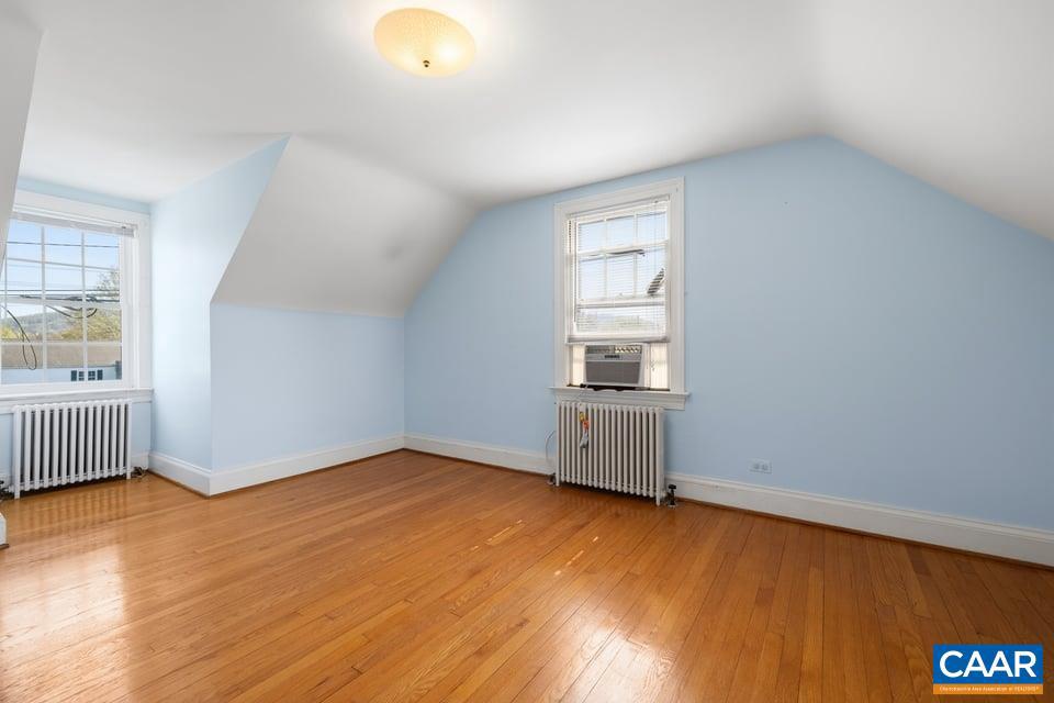 1201 Avon Street Charlottesville, VA 22902 - Photo 44 of 71 an empty room with wooden floor and windows